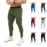 Мужские узкие спортивные брюки с карманами на молнии и шнурком